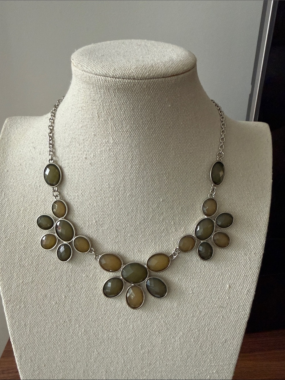 NWT Cookie Lee Silver Tone Bib Necklace with Sage Green Faceted Oval Stones.